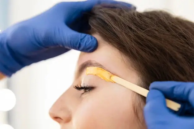 The eyebrow waxing process